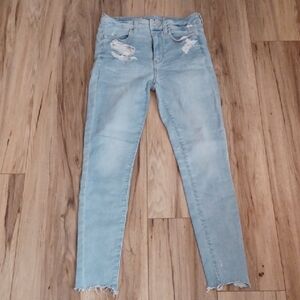 J1 - American Eagle Outfitters Light Blue Ripped Skinny Jeans. Size 4